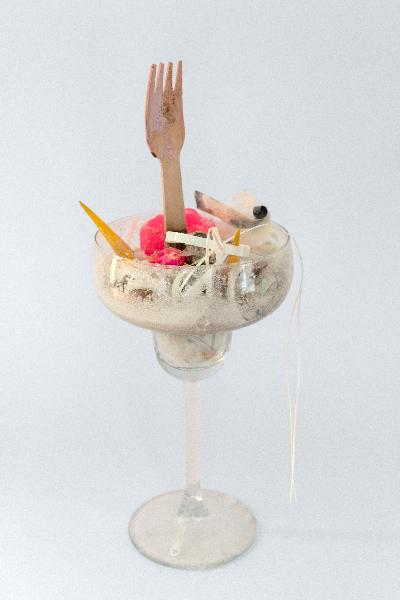 So delicious,2021,
Old studio final party leftovers,
New studio dirt and dust,
Inner shape of a pleasure egg
cast in Resin
and eyeshadow called
'Bubble gum',
Fork used to eat a doll shaped cake,
Earring worn in drag,
Nails worn in drag,
White glitter, Crystallised sea salt,
Resin